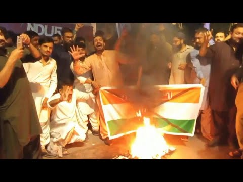 Pakistani protesters burn Indian flag after missile strikes | AFP