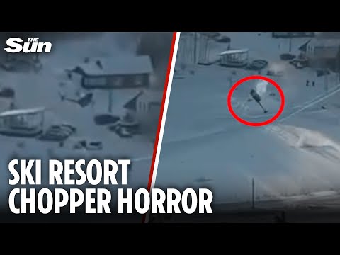 Horrifying moment helicopter CRASHES into ski lift cables at mountain resort