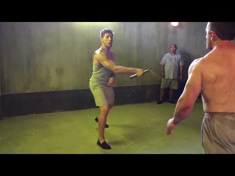 Kickboxer whacks dude with nunchucks!!