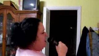 Mom singing the theme song to All in the Family