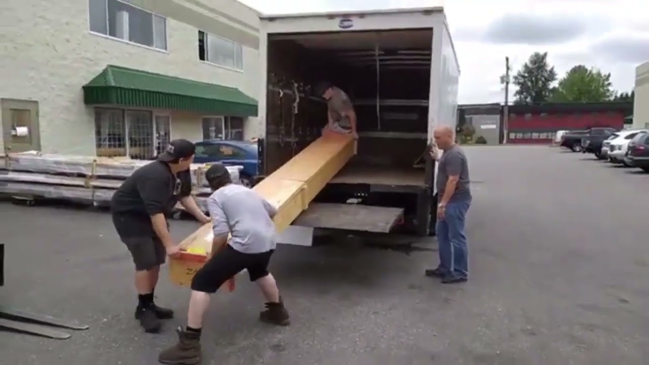 Unloading Greenhouse Crates From BC Greenhouse Builders