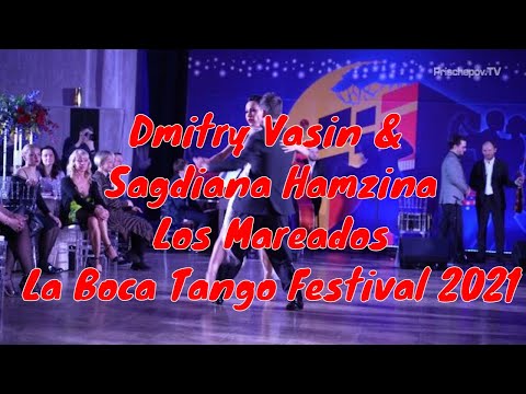  Dmitry Vasin  and  Sagdiana Hamzina  are  dancing  to  the  tango  "  Los Mareados  "  by  Solo Tango Orquesta  at  La Boca Tango Festival  in  2021