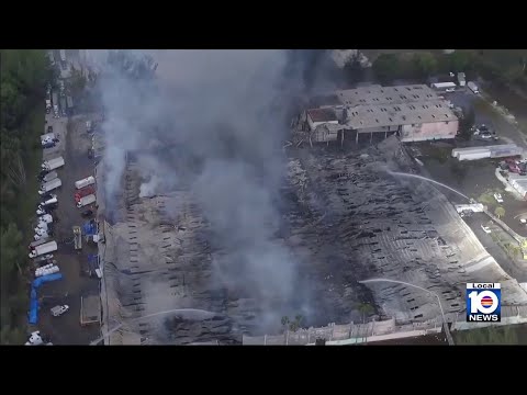 Hot spots still burning after massive warehouse fire in northwest Miami-Dade