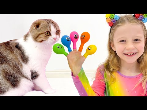 Nastya pretends to play and teaches kittens colors