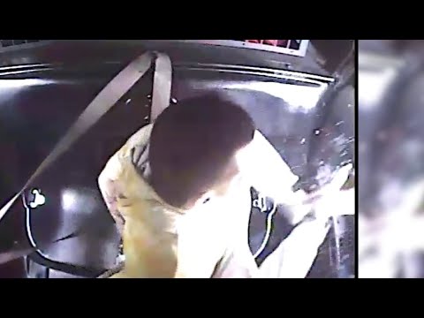 Man kicks out Troy police car window with his bare feet