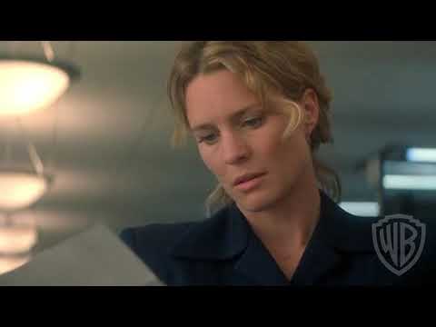 Closing trailer shot with Theresa walking along the shoreline holding a letter