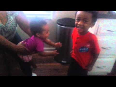 Baby sister goes crazy for his "six pack"