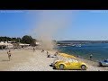 Dust Devil Sends Chairs Small Boat Flying At Seaside Resort