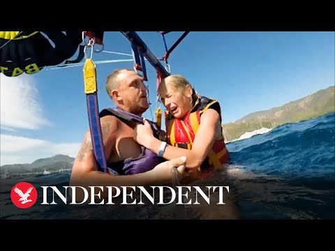 Couple's parasail gets entangled with another, sending them crashing into sea