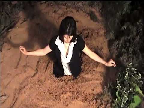 Girl sinking in quicksand 