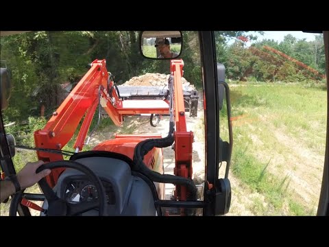 Kioti RX7320 Testing out the loader on the duck pond dam, land management