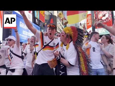 Germany and Ecuador World Cup fans fill Times Square with flags, drums and music
