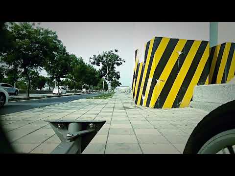 20" leaning cargo trike riding up sidewalk step 20180526