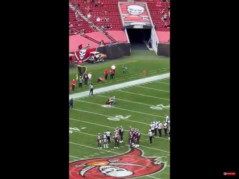 A bucs fan breaks protocol and runs into the field