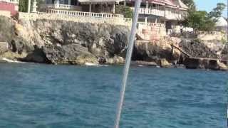 preview picture of video 'Western end of Negril from sunset cruise, Jamaica'