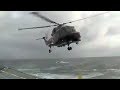 Lynx Helicopter Landing On A Ship In Stormy Weather