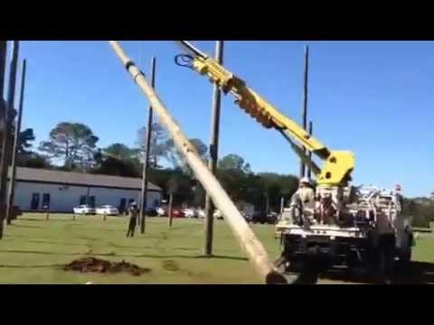 Lineworkers and Wiregrass Electric install new poles at WCC