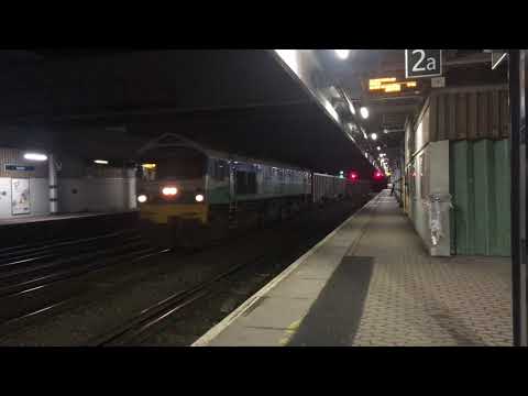 The class 59 passing through Redhill station with a loud horn.