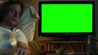The Bear Carmy falling asleep watching TV green screen