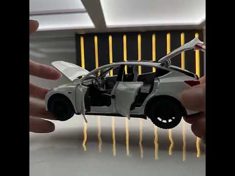 Модель Tesla Model Y (белая) коллекционная машинка, масштаб 1:32 - фото 1 - id-p2539368131