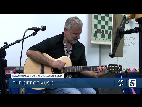 From glued-together to new guitar: Ruby Major's Mr. K and students receive donation