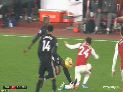 Pogba get straight red card by the referee for stamping on the back of Bellerin's leg