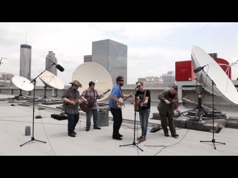 Trampled by Turtles performs atop CNN Center.