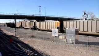 preview picture of video 'BNSF # 9432, #9354 pushers on coal train in  Belen , New Mexico with coal train from the West'