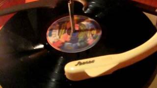 The Dire Straights-Walk of life: A vinyl record played on a vinatge tube stereo