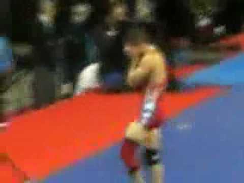 Abas leaves his shoes on the mat.