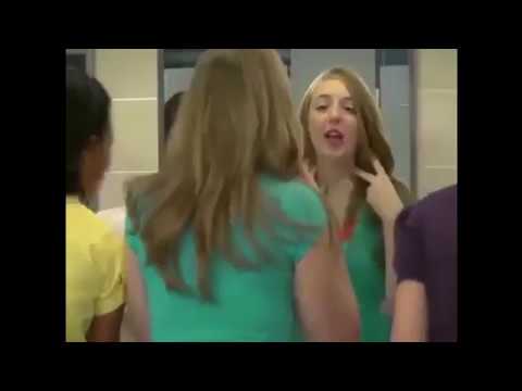 Janitor teaches girls how to clean lipstick off of bathroom mirror