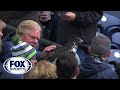 Huge Bird Lands On Fans Head At Seattle.
