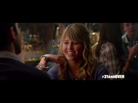 Official trailer still for 21 & Over: neon party lights over a chaotic college night