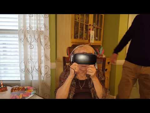 Samsung Gear VR, thinks the Dinosaur is going to step on her.