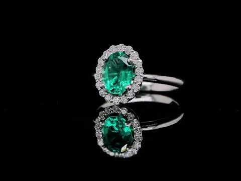 Emerald and Diamond Halo Ring in 18K White Gold - Orogem Jewelers