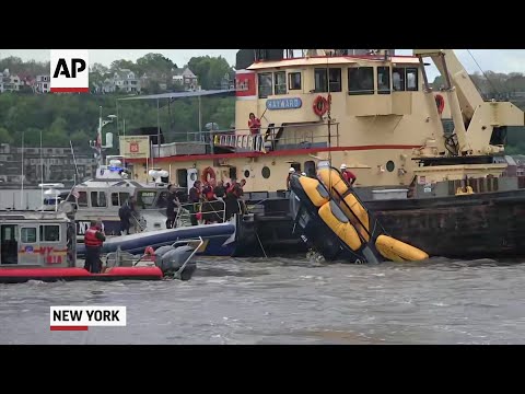 A helicopter that crashed into the Hudson River near a busy NYC heliport Wednesday and partially sank, was pulled from the water. New York City officials said the pilot was able to escape, and was being treated for non-life-threatening injuries. (May 15)