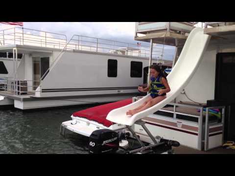Molly sliding down house boat slide