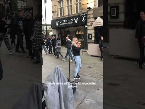 Busker sings “Read all about it” in Piccadilly london.