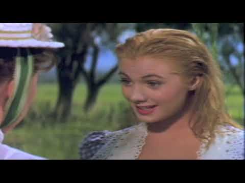 Oklahoma! (1955) theatrical trailer still — Curly riding through the corn as dawn breaks
