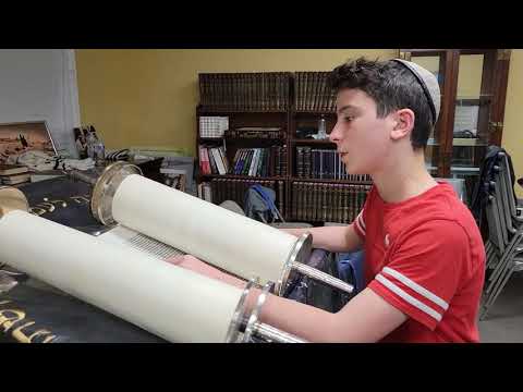 Noah Steinman reading from the Torah in preparation for his bar mitzvah