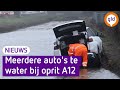 Auto's raken te water in Bennekom