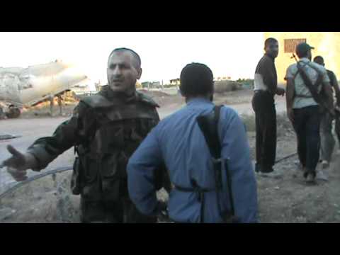 جولة ميدانية مع العقيد الطيار الركن قاسم سعد الدين قائد المجلس العسكري في مدينة حمص وريفها داخل كتيبة الصواريخ أثناء معركة التحرير