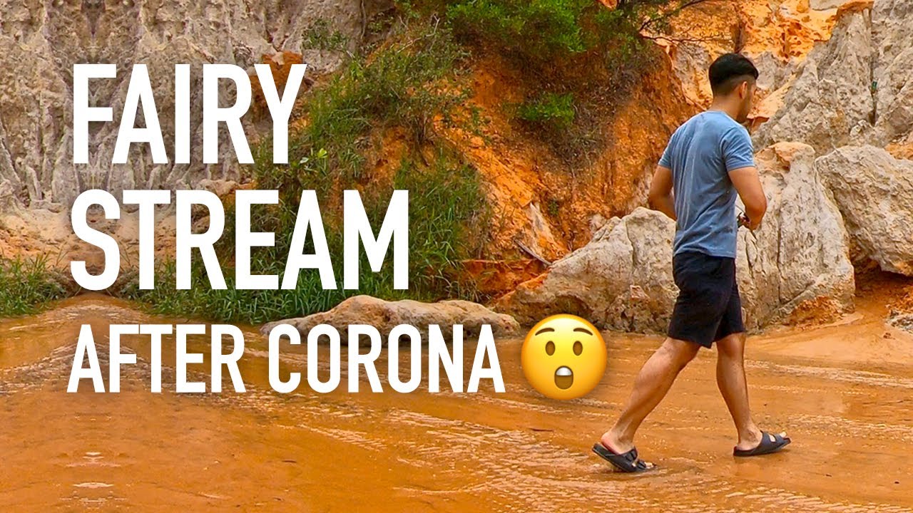 Adventurers stroll along the serene, magical path of the Fairy Stream's vibrant waters.