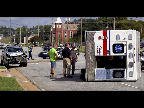 Ambulance knocked on its side during crash is righted again