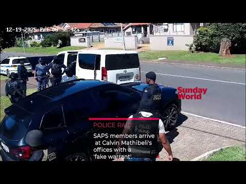SAPS members arrive at the business offices of the security boss, Calvin Mathibeli