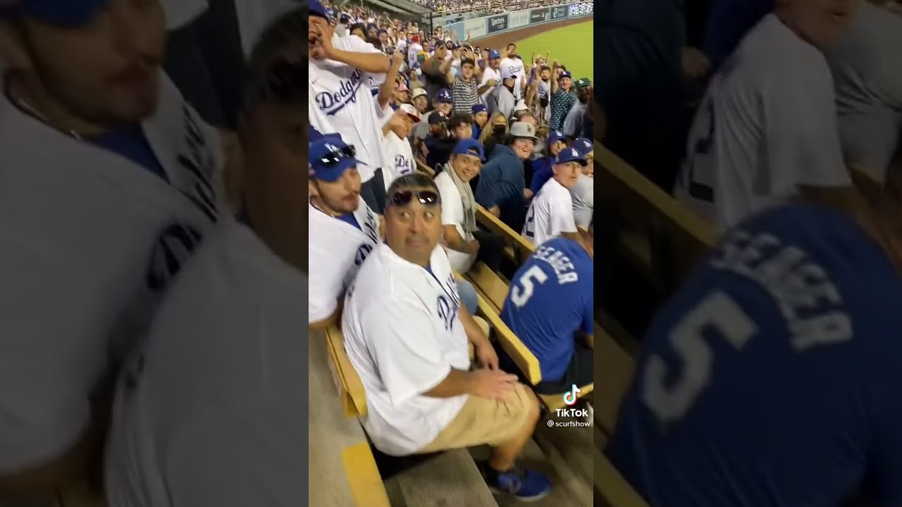 An Astro fan walking through dodger stadium in Asstros Gear