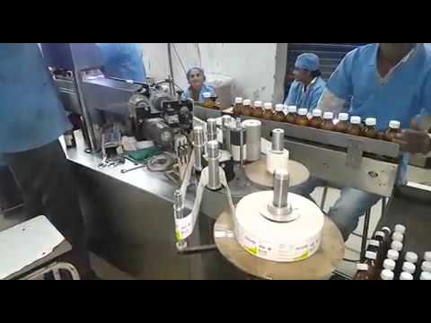 Sticker labelling machine for pharma small round bottle