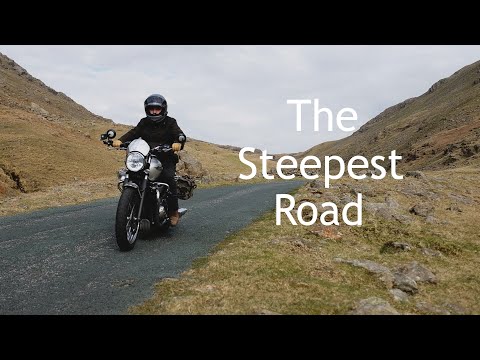 Riding a Triumph Bonneville T120 over Hardknott Pass.