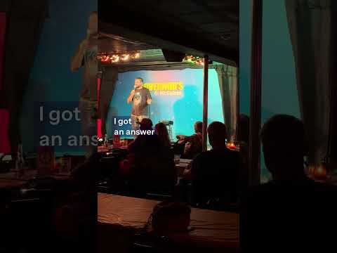 Hugh Murray IV with a heckler at McGuire’s Comedy Club
