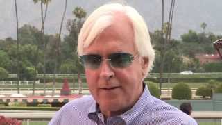 American Pharoah's trainer Bob Baffert talks with Aaron Vercruysse